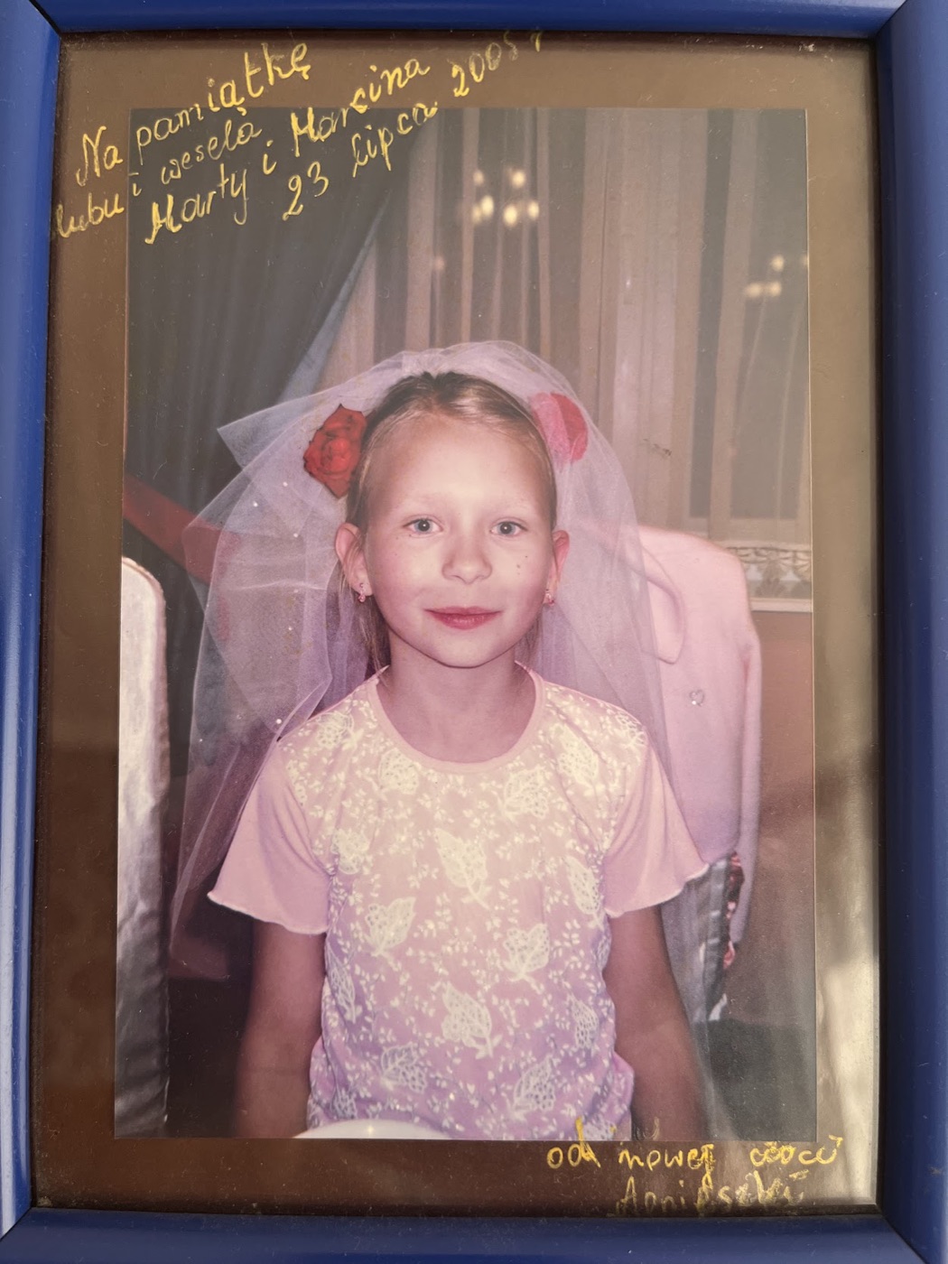 Alice as a child in Poland, in a framed photograph