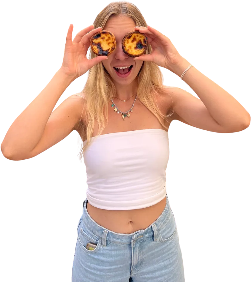 Alice holding two custard tarts up over her eyes